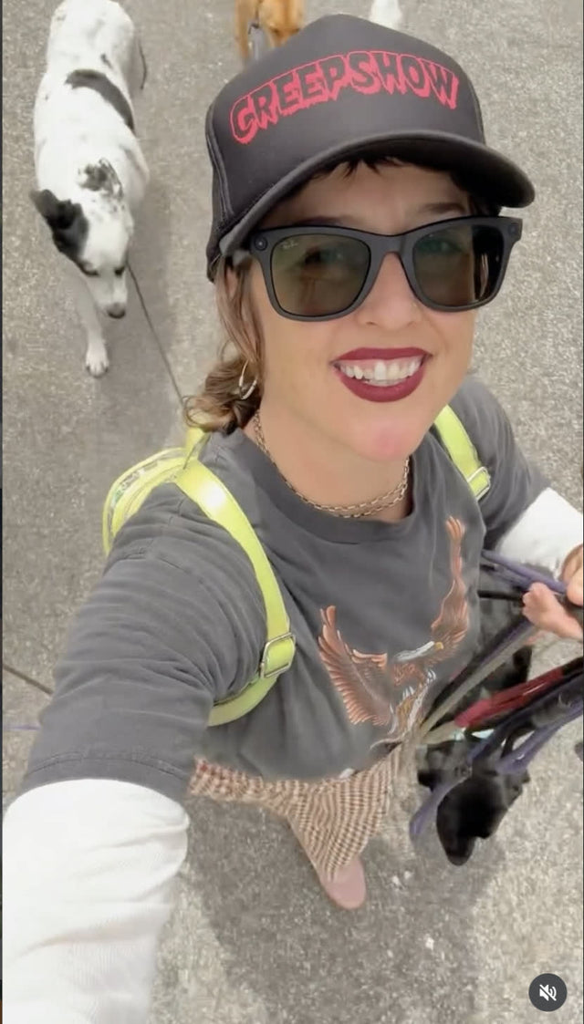Rachel mid pack walk with dogs on leads behind her